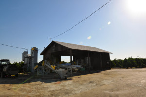 The barn with some farm equipment