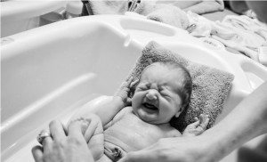 First bath at home, sweet little baby was not crazy about it. She loves them now :)